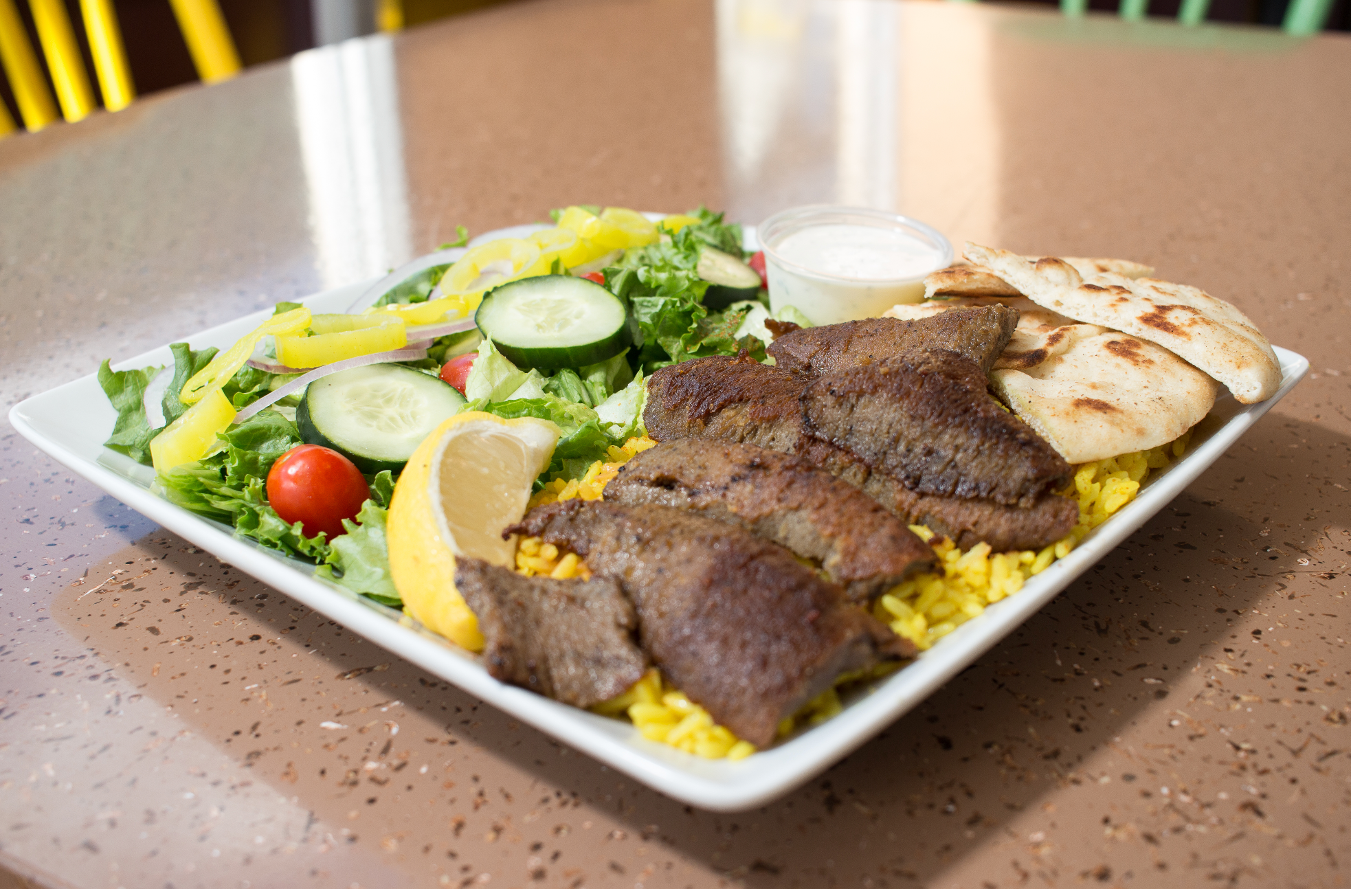 Gyros over rice & salad or fries